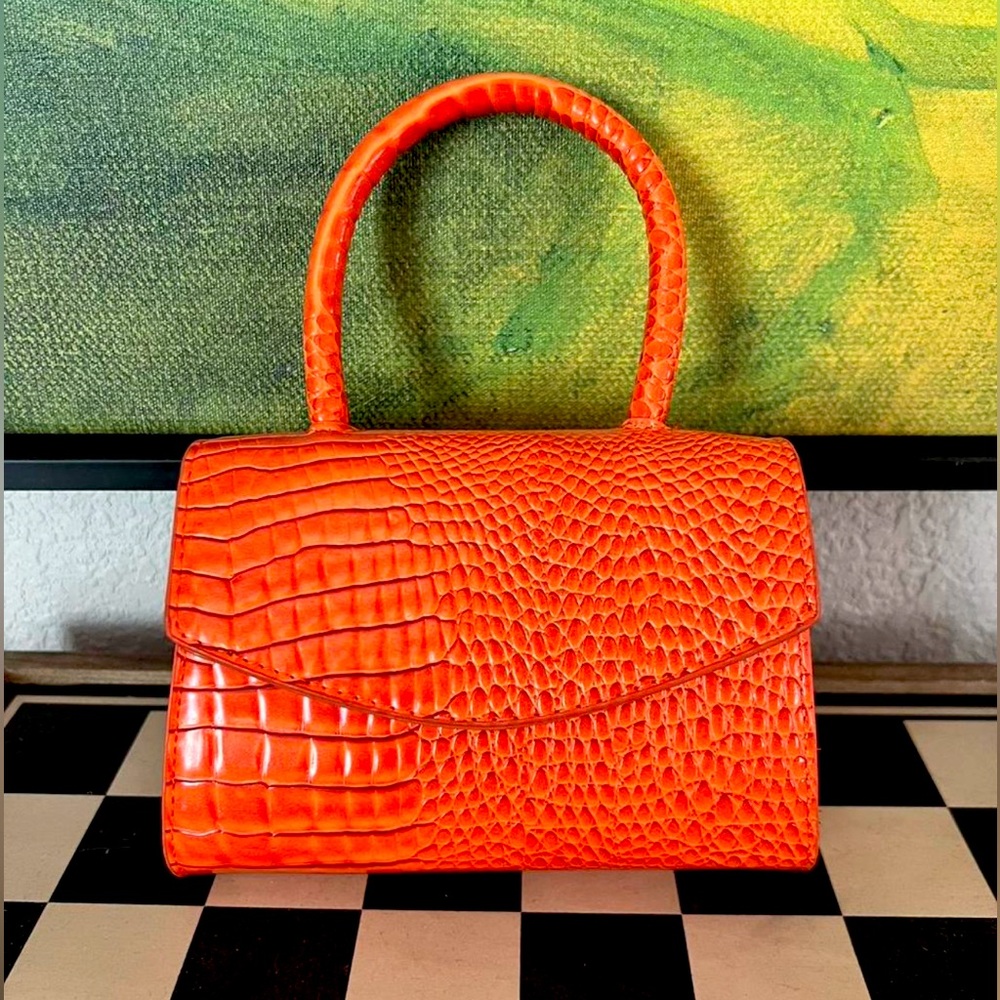 New. Never used. Faux crocodile skin mini crossbody.